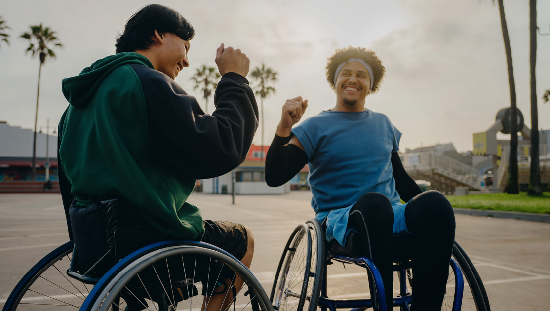 men in wheelchairs playing basketball
